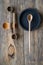 Top view wooden spoons and plates made of precious wood on wooden table, eco-friendly cutlery concept, selective focus