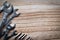 Top view wooden table, Steel wrench and hexagon keys pile on the left with copy space.