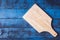 Top view of wooden tray on bule wooden table background.