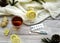 Top view Wooden word sick, Tea with lemon, thermometer, ginger, honey, tablets and dry leaves on a white background