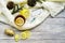 Top view Wooden word sick, Tea with lemon, thermometer, ginger, honey, tablets and dry leaves on a white background