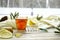 Top view Wooden word sick, Tea with lemon, thermometer, ginger, honey, tablets and dry leaves on a white background