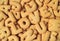 Top view of the word I LOVE U spelled with alphabet shaped biscuits on the pile of same biscuits