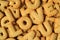 Top view of the word I LOVE YOU spelled with alphabet shaped biscuits on the pile of of the same biscuits