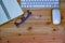 top view of working desk table with keyboard, mouse, notebook, glass