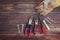 Top view of worn work gloves and assorted work tools over wooden background