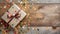 top view of a wrapped present with bow on a rustic old table with confetti