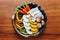 Top view of Yakiniku Grilled Meat vegetables set include carrot, sliced bell pepper, sliced onion, sliced pumpkin, eryngii.
