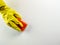 Top view of a yellow cleaning rubber glove and orange sponge as domestic supplies for domestic cleaning on a white background