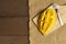 Top view yellow half  mango with small fork. Mango fruit cubes on the wooden table. Tropical fruit asia. Fresh yellow mango peel