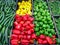 Top view of yellow, red and green pepper and other vegetables