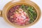 Top view yentafo rice noodles pink soup in bowl isolated on white background