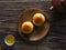 Top view of yolk pastry and Oolong tea on wooden background. With copy space. Flat lay. Taiwan food