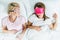 top view of young girls sleeping in masks