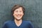 Top view of a young man with space for text and symbols on the old wooden background. Concept for confusion