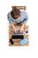 Top view of a young man working on a laptop and sitting on a wooden coffee table