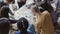 Top view of young team working on new project. Group of mixed race people standing near the table and discussing.