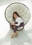 Top view.young woman sitting in soft round chair