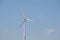 Top of a wind turbine on a blue sky