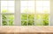 Top of wood table counter on blur window view garden background.