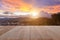 Top wooden table and blur sunset background