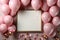 Topdown view pastel pink table, balloonframed frame, confetti perfect birthday flat lay