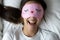 Tope view close up overjoyed woman wearing funny sleeping mask