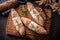 Tope view of freshly baked pastry bread on a vintage wooden board with dark background