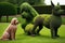 topiary with animal shapes, including dog and cat