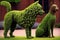 topiary with animal shapes, including dog and cat