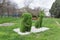 Topiary figures made of grass on the streets of the city.