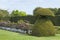 Topiary garden with flowers, trees, tall hedge