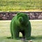 Topiary sculpture of a bear made of artificial grass