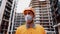 Topic is health protection in production and construction. Caucasian male worker in orange uniform and protective respirator kn 95