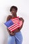 Topless black woman with American national flag