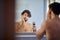 Topless man shaving with shaver