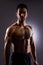 Topless, muscle and portrait of Asian man in dark background for fitness inspiration, beauty aesthetic or healthy body