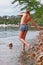 Topless woman paddling in lake