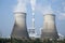 Tops of cooling towers of atomic power plant under blue sky