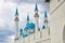 The tops of the minarets of the Kul Sharif mosque in the Kazan Kremlin. Beautiful white mosque with blue domes
