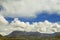 The tops of mountains under the beautiful volume clouds.