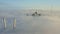 Tops of the pylons of the Golden Bridge in the dawn fog in Vladivostok
