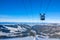 Tops of the Winter Mountains and the Cabin Skilift