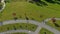 Topview Aerial shot of two little boys riding bicycles in a park