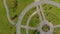 Topview Aerial shot of two little boys riding bicycles in a park