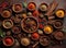 Topview of an array of assorted spices elegantly displayed on a kitchen table