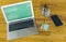 Topview flat lay of business working place laptop, phone, stickers and other office items.