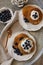 Topview image of oatmeal pancakes topped with yogurt and berries