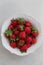 Topview image of strawberries in a white bowl