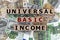 Topview photo on universal basic income theme. wooden cubes with the inscription `universal basic income`